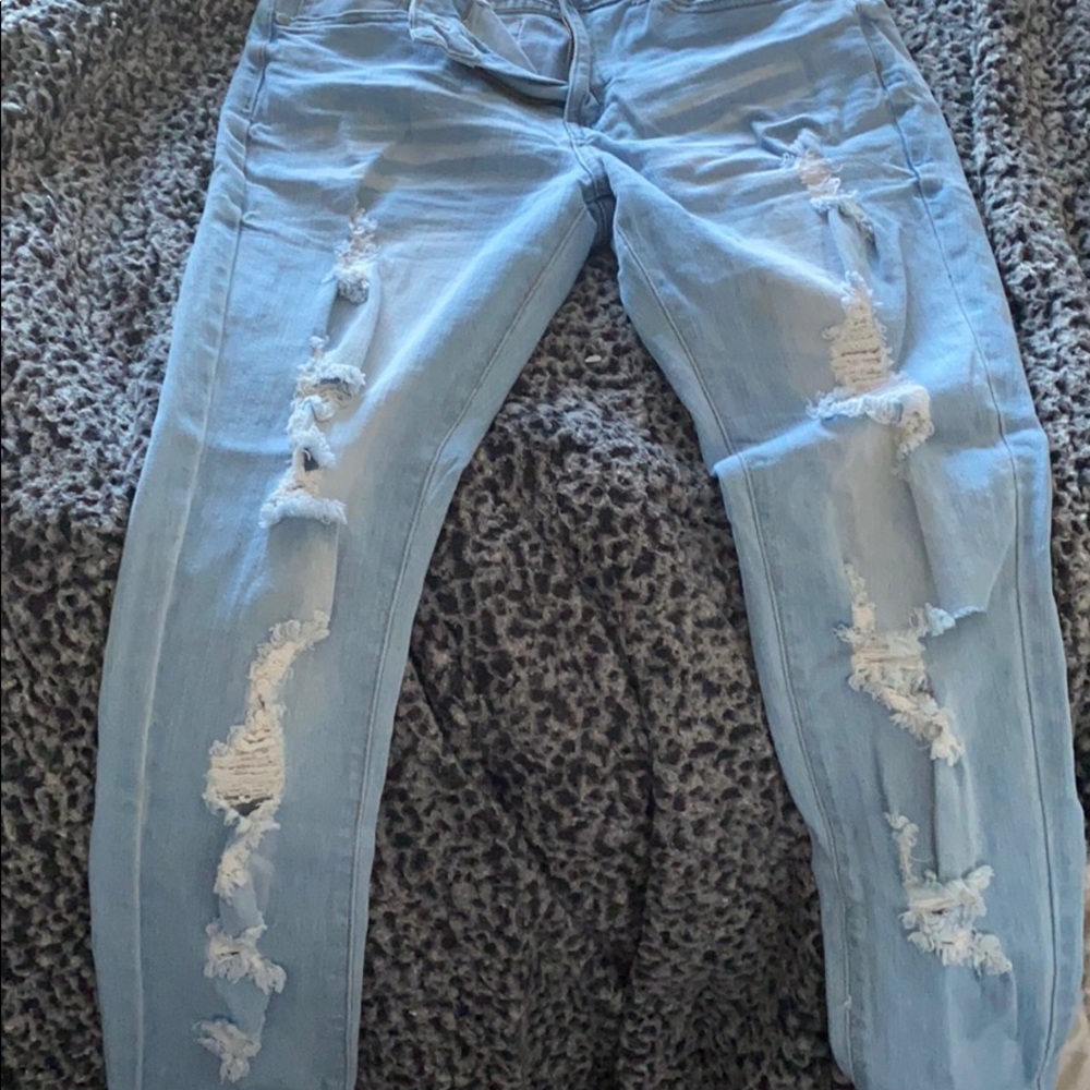 light blue ripped jeans